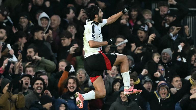 Raul Jimenez leaps in celebration after scoring Fulham's opening goal against Bournemouth