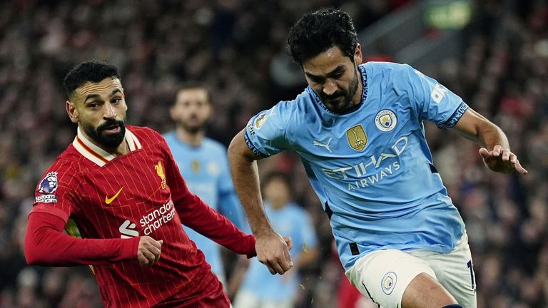 Ilkay Gundogan takes on Mohamed Salah