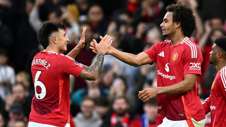 Joshua Zirkzee is congratulated by Lisandro Martinez after scoring Man Utd's fourth goal against Everton