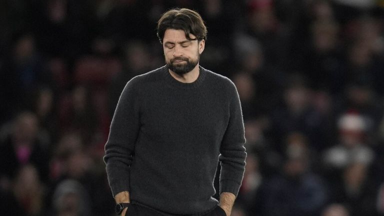 A dejected Russell Martin paces the touchline as his Southampton side fall 4-0 down to Spurs