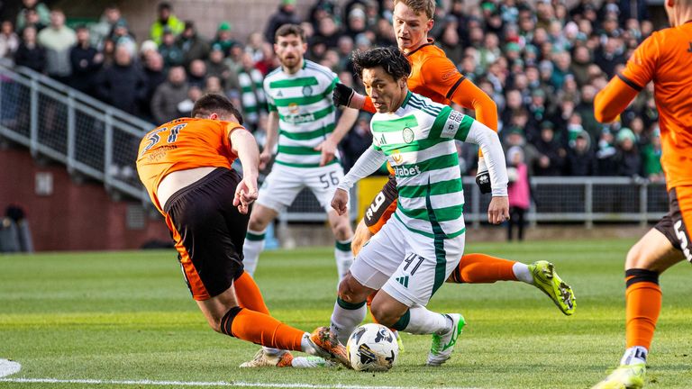 Celtic's Reo Hatate and Dundee United's Declan Gallagher in action