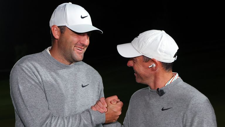 Scottie Scheffler and Rory McIlroy celebrate after winning during The Showdown at Shadow Creek Golf Course