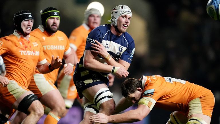 Bristol Bears' Fitz Harding (centre) is tackled by Sale Sharks' Jonny Hill (right)