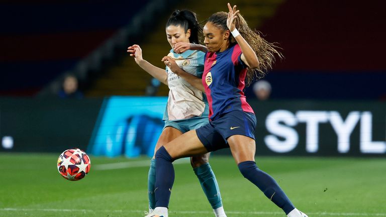 Barcelona's Salma Paralluelo vies for the ball with Manchester City's Leila Ouahabi, left, during the women's Champions League group D soccer match between FC Barcelona and Manchester City at the Olympic Stadium in Barcelona, Spain, Wednesday, Dec. 18, 2024. (AP Photo/Joan Monfort)