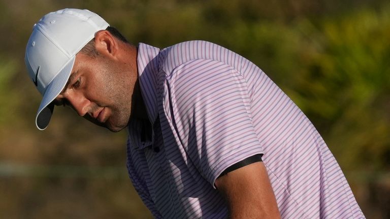 Scottie Scheffler of the United States watches his putt on the 18th green during the second round of the Hero World Challenge PGA Tour at Albany Golf Club in New Providence, Bahamas, Friday, Dec. 6, 2024. (AP Photo/Fernando Llano)