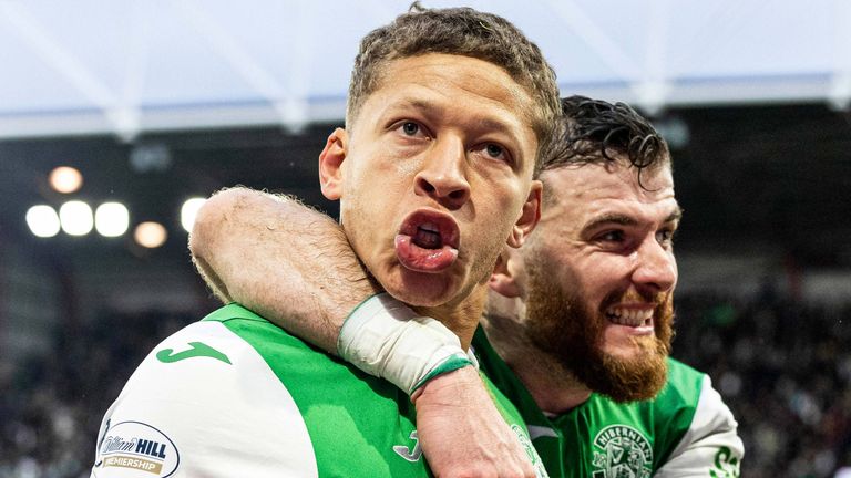 Dwight Gayle celebrates with Nicky Cadden after restoring Hibernian's lead at Hearts