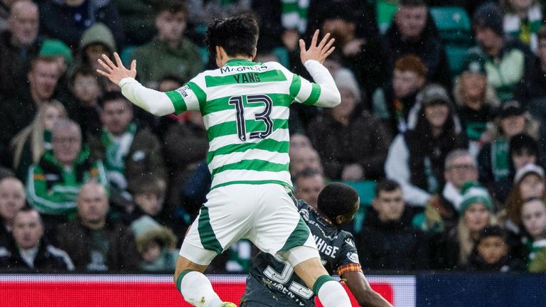 GLASGOW, SCOTLAND - DECEMBER 26: Motherwell's Tawanda Maswanhise (R) goes down under a challenge from Celtic's Hyunjun Yang but is booked for simulation during the William Hill Premiership match between Celtic and Motherwell at Celtic Park on December 26, 2024 in Glasgow, Scotland. (Photo: Craig Foy / SNS Group)