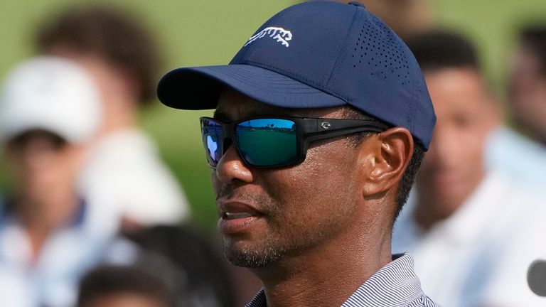 FILE - Tiger Woods watches his son Charlie Woods during the second round of stroke play at the U.S. Junior Amateur Golf Championship on July 23, 2024, in Bloomfield Township, Mich. (AP Photo/Carlos Osorio, File)