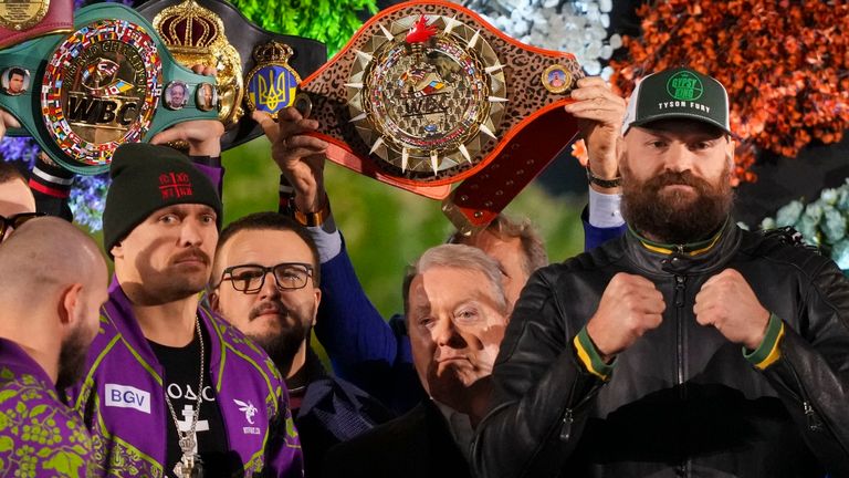 Boxers Britain's Tyson Fury, right, and world champion Ukraine's Oleksandr Usyk, center left, stand on stage during the weigh-in for their WBA, WBO, and WBC heavyweight title bout in Riyadh, Saudi Arabia, Friday, Dec. 20, 2024. (AP Photo/Frank Augstein)