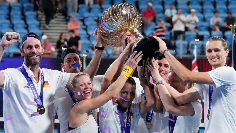 Team Germany hold their trophy aloft after defeating Team Poland in the final of the United Cup in Sydney, Australia, Monday, Jan. 8, 2024. (AP Photo/Mark Baker)