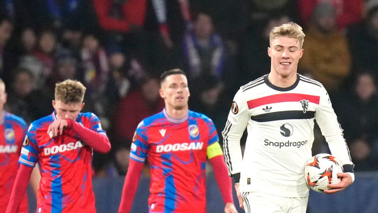 Manchester United player Rasmus Hoglund, right, celebrates after scoring his team's opening goal during the Europa League soccer match between Viktoria Plzeň and Manchester United at the Dusan Arena in Plzeň, Czech Republic, Thursday, December 12, 2024. (AP Photo/Peter David Gosek)