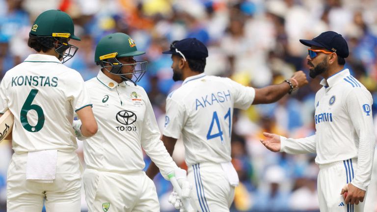 Virat Kohli (R) shares a heated exchange with Sam Konstas (L) and Usman Khawaja 