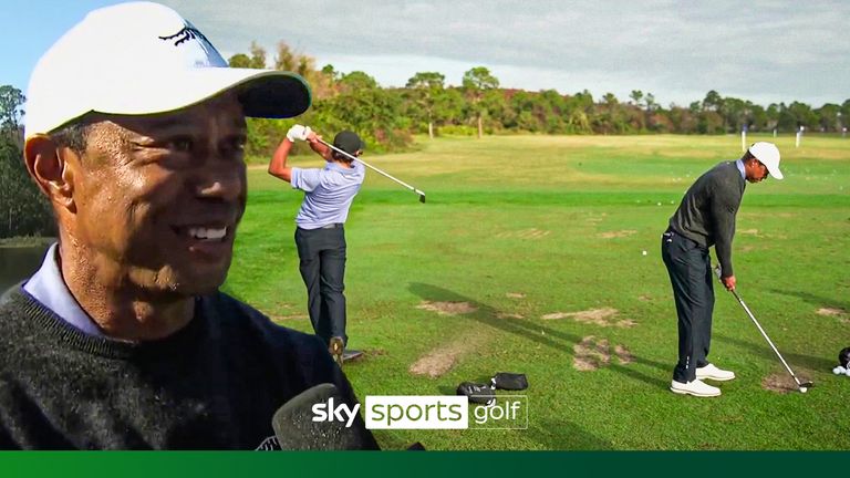 Tiger Woods practise with son