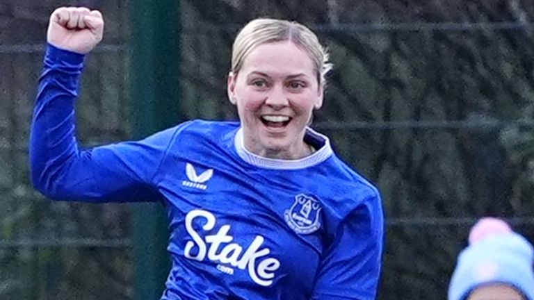 Lucy Hope leaps in celebration after giving Everton a first-half lead against Man City