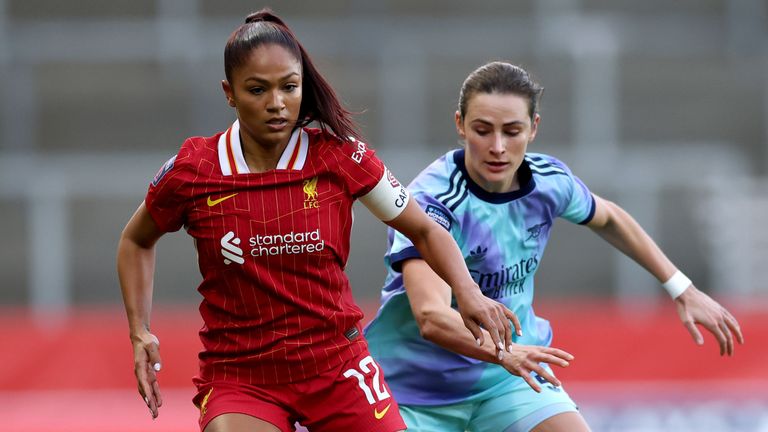 Taylor Hinds controls the ball under pressure from Emily Fox