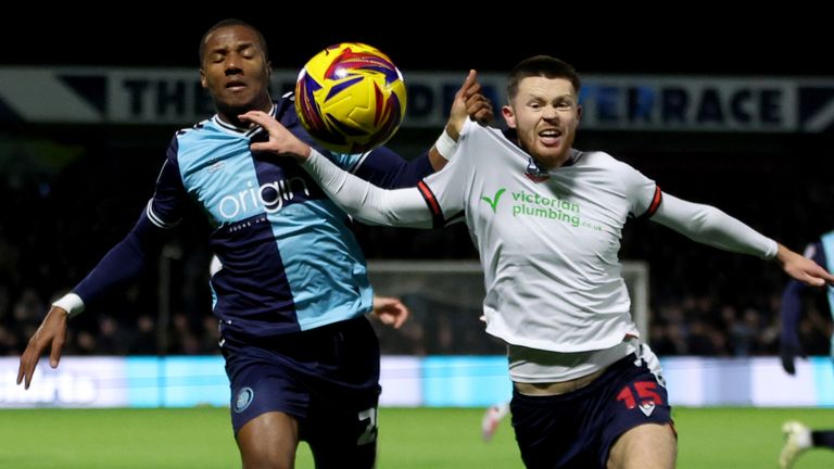 Wycombe's Richard Kone and Bolton Wanderers' William Forrester battle for the ball