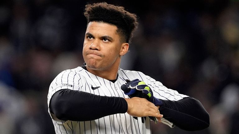 New York Yankees' Juan Soto takes off his batting gloves after grounding out against the New York Yankees to end the third inning in Game 3 of the baseball World Series, Monday, Oct. 28, 2024, in New York. (AP Photo/Godofredo A. V..squez)