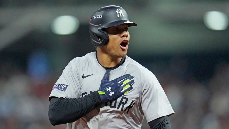 New York Yankees' Juan Soto celebrates after hitting a three-run home run against the Cleveland Guardians during the 10th inning in Game 5 of the baseball AL Championship Series Saturday, Oct. 19, 2024, in Cleveland. The Yankees won 5-2 to advance to the World Series. (AP Photo/Sue Ogrocki)