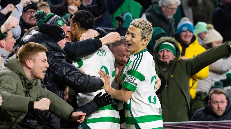 Celtic player Adam Idah (left) celebrates as his shot rebounds into the net to secure Champions League qualification.