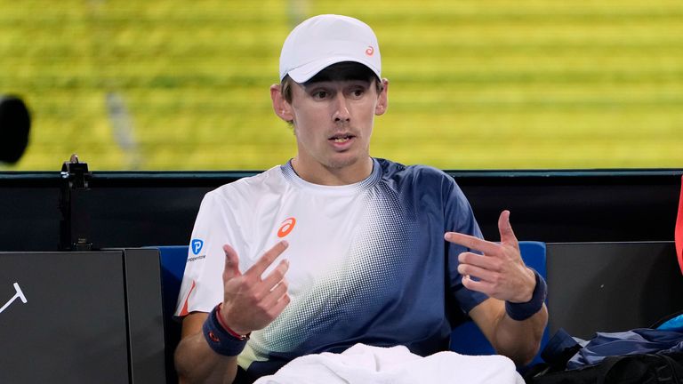 Alex de Minaur of Australia reacts as he sits in his chair during his quarterfinal match against Jannik Sinner of Italy at the Australian Open tennis championship in Melbourne, Australia, Wednesday, Jan. 22, 2025. (AP Photo/Ng Han Guan)