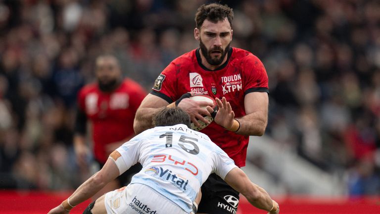 Toulon's French flanker Charles Ollivon (Top) is tackled by Racing92's French full back Max Spring during the French Top 14 rugby union match between RC Toulon and Racing92 at the Mayol stadium in Toulon, southeastern France, on January 4, 2025. (Photo by MIGUEL MEDINA / AFP)