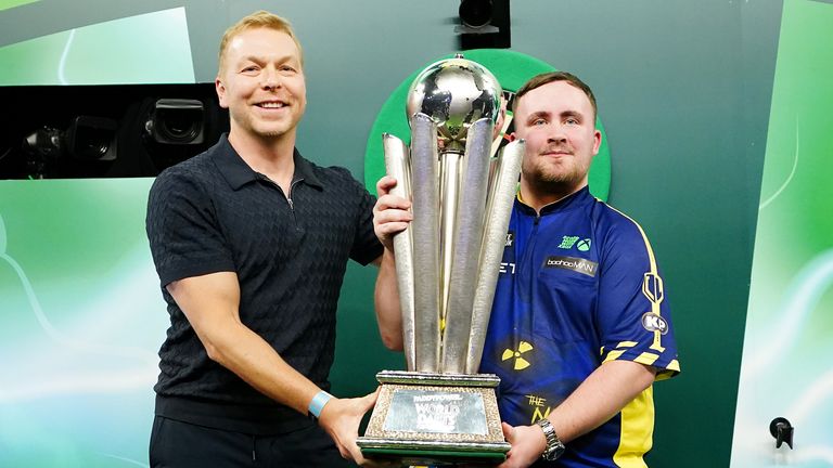 Sir Chris Hoy presents The Sid Waddell Trophy to Luke Littler after he won the Paddy Power World Darts Championship 