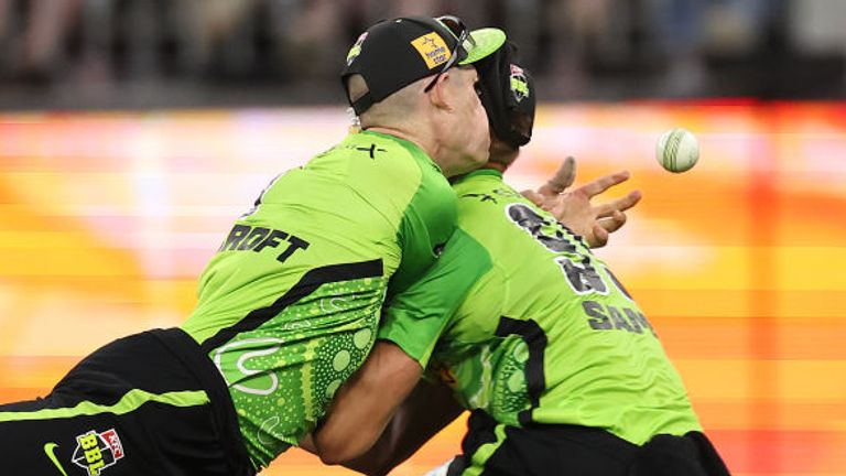 Sydney Thunders' Cameron Bancroft (L) and Daniel Sams (R) collided after attempting to take a catch against Perth Scorchers in the Big Bash (Getty Images)