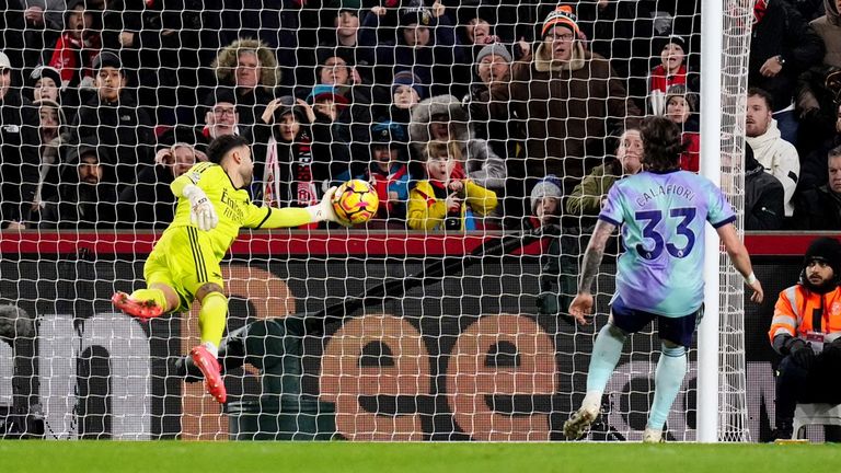 David Raya claws the ball away from goal