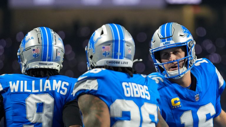 Detroit Lions quarterback Jared Goff (16) congratulates running back Jahmyr Gibbs (26) on his touchdown run against the Washington Commanders