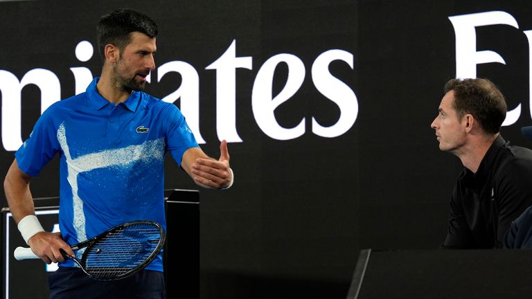 Novak Djokovic, left, of Serbia talks with his coach Andy Murray during his first round match against Nishesh Basavareddy of the U.S. at the Australian Open tennis championship in Melbourne, Australia, Monday, Jan. 13, 2025. (AP Photo/Asanka Brendon Ratnayake)