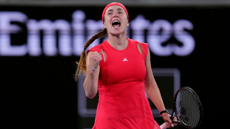 Elina Svitolina of Ukraine celebrates after defeating Jasmine Paolini of Italy in their third round match at the Australian Open tennis championships in Melbourne, Australia, Saturday, Jan. 18, 2025. (AP Photo/Vincent Thian)