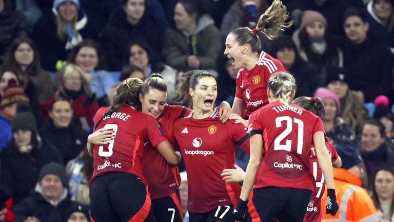 Man Utd players celebrate Ella Toone's opener against Man City in the WSL Manchester derby