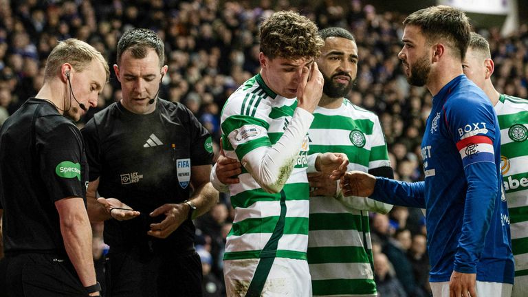 GLASGOW, SCOTLAND - JANUARY 02: Celtic's Arne Engels is struck with a coin which is thrown by a Rangers fan during a William Hill Premiership match between Rangers and Celtic at Ibrox Stadium, on January 02, 2025, in Glasgow, Scotland.  (Photo by Alan Harvey / SNS Group)