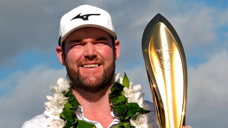 FILE -Grayson Murray holds the trophy after winning the Sony Open golf event, Sunday, Jan. 14, 2024, at Waialae Country Club in Honolulu. Two-time PGA Tour winner Grayson Murray died Saturday morning, May 25, 2024 at age 30, one day after he withdrew from the Charles Schwab Cup Challenge at Colonial(AP Photo/Matt York, File) 