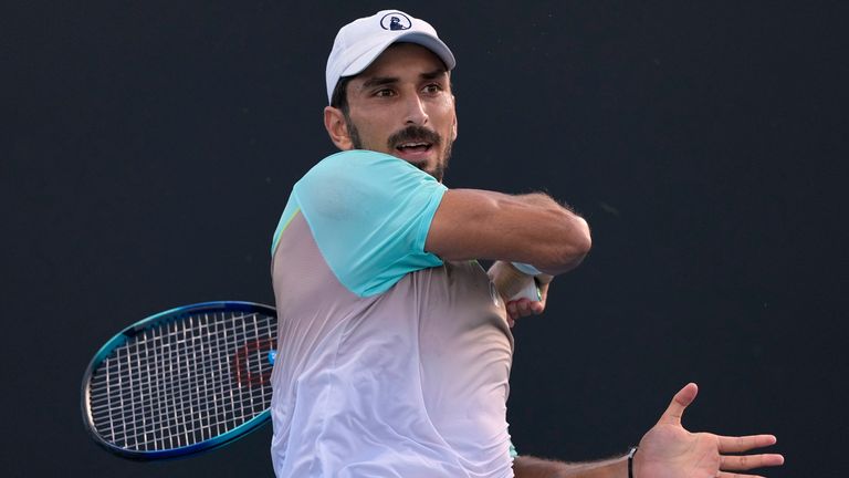 Hady Habib of Lebanon plays a forehand return to Bu Yunchaokete of China during their first round match at the Australian Open tennis championship in Melbourne, Australia, Sunday, Jan. 12, 2025. (AP Photo/Asanka Brendon Ratnayake)