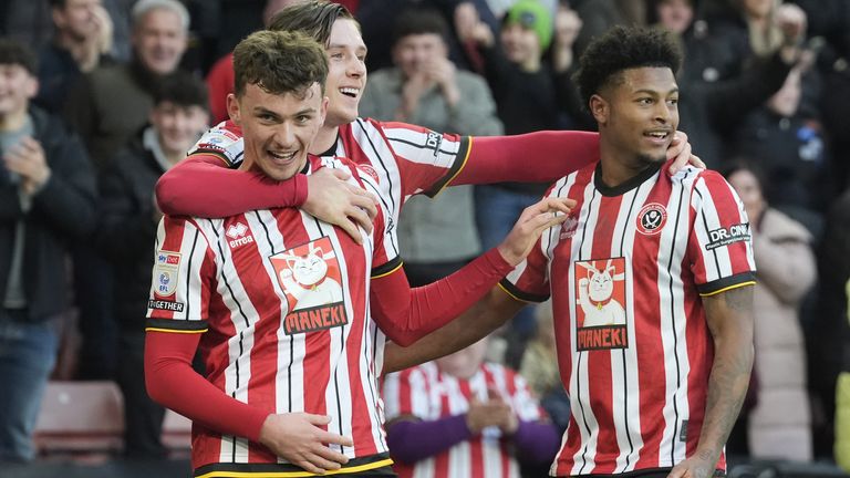 Sheffield United's Harrison Burrows (left) celebrates with team-mates after scoring their side's first goal of the game