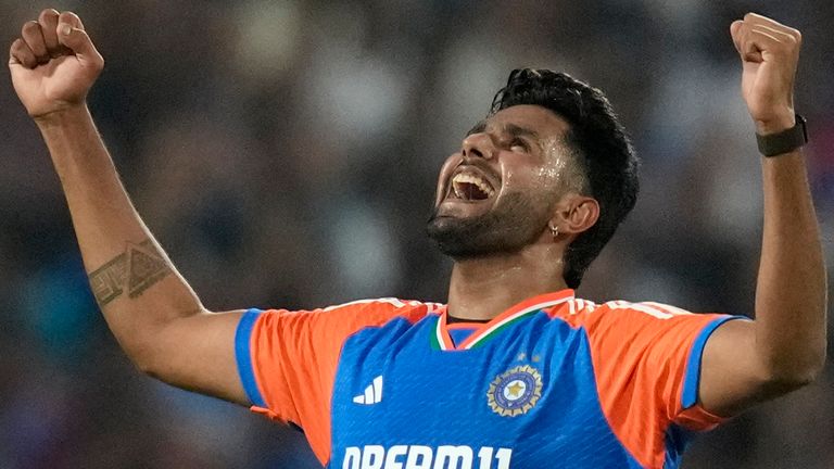 India's Harshit Rana celebrates the wicket of England's Jamie Overton during the fourth T20 cricket match between England and India in Pune, India, Friday, Jan. 31, 2025. (AP Photo/Rafiq Maqbool)