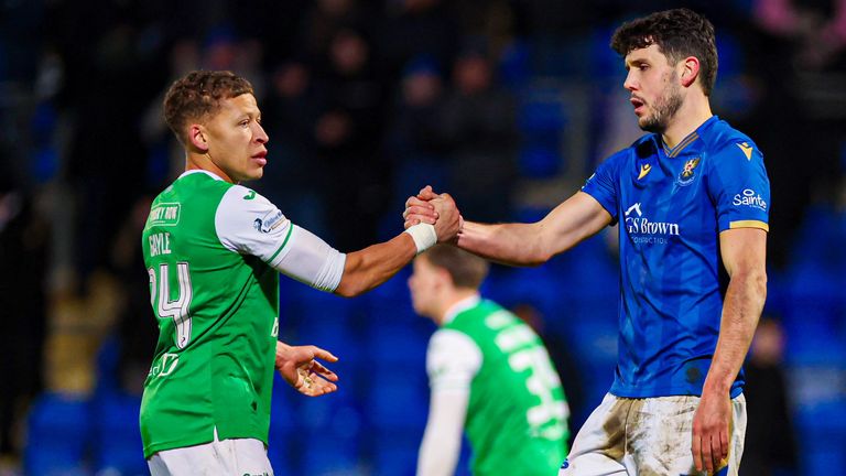 PERTH, SCOTLAND - JANUARY 02: Hibernian's Dwight Gayle (L) and St Johnstone's Jack Sanders at full time during a William Hill Premiership match between St Johnstone and Hibernian at McDiarmid Park, on January 02, 2025, in Perth, Scotland.  (Photo by Roddy Scott / SNS Group)