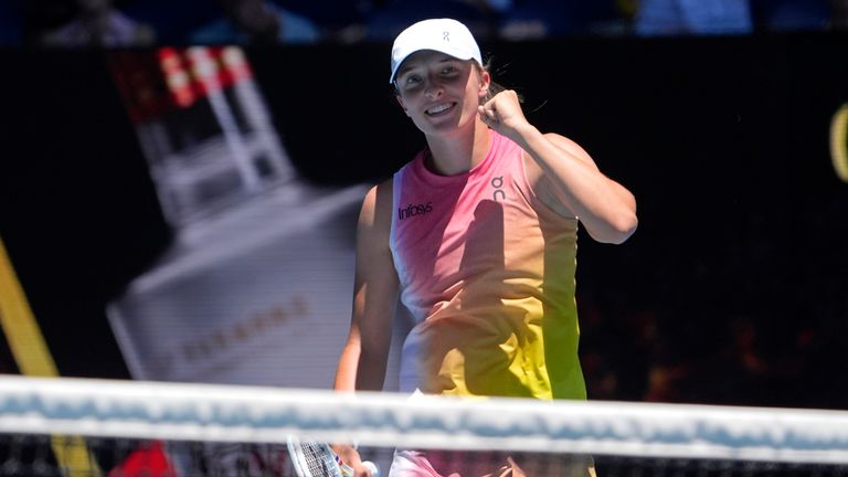 Iga Swiatek of Poland reacts after defeating Emma Raducanu of Britain in their third round match at the Australian Open tennis championship in Melbourne, Australia, Saturday, Jan. 18, 2025. (AP Photo/Asanka Brendon Ratnayake)