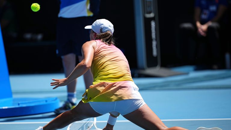 Poland's Iga Swiatek returns a forehand to Emma Navarro during their quarterfinal match at the Australian Open in Melbourne, Australia, Wednesday, Jan. 22, 2025. (AP Photo/Vincent Thian)