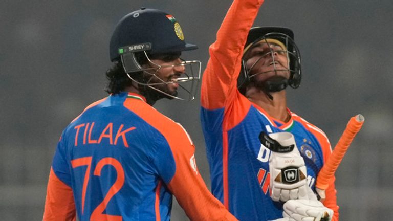 India's Abhishek Sharma, right, celebrates after scoring fifty runs during the first T20 cricket match between India and England at Eden Gardens in Kolkata, India, Wednesday, Jan. 22, 2025. (AP Photo/Bikas Das)