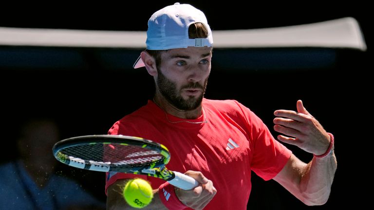 Jacob Fearnley of Britain plays a forehand return to Alexander Zverev of Germany during their third round match at the Australian Open tennis championship in Melbourne, Australia, Friday, Jan. 17, 2025. (AP Photo/Vincent Thian)