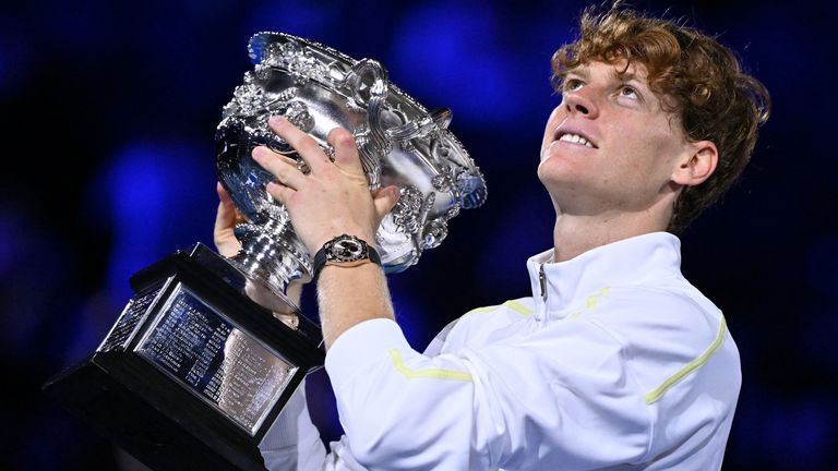 Italy's Jannik Sinner celebrates with the Norman Brookes Challenge Cup trophy after defeating Germany's Alexander Zverev during their men's singles final match on day fifteen of the Australian Open tennis tournament in Melbourne on January 26, 2025. (Photo by WILLIAM WEST / AFP) / -- IMAGE RESTRICTED TO EDITORIAL USE - STRICTLY NO COMMERCIAL USE --