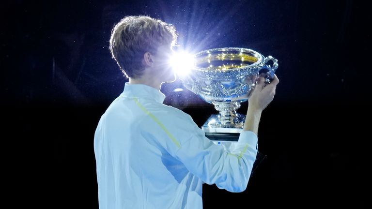 Jannik Sinner of Italy holds the Norman Brookes Challenge Cup after defeating Alexander Zverev of Germany in the men's singles final at the Australian Open tennis championship in Melbourne, Australia, Sunday, Jan. 26, 2025. (AP Photo/Vincent Thian)