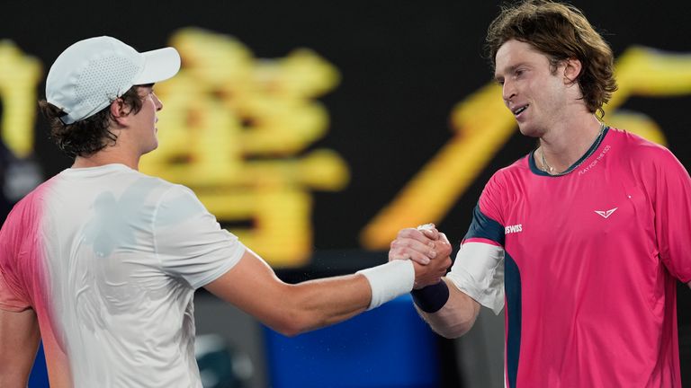 Joao Fonseca of Brazil is congratulated by Andrey Rublev, right, of Russia following their first round match at the Australian Open tennis championship in Melbourne, Australia, Tuesday, Jan. 14, 2025. (AP Photo/Asanka Brendon Ratnayake)