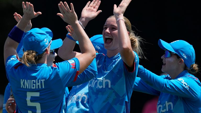 England's Lauren Bell, second right, celebrates with teammates after taking the wicket of Australia's Ellyse Perry during their Women's Ashes one day international cricket match in Sydney, Australia, Sunday, Jan. 12, 2025. (AP Photo/Rick Rycroft)