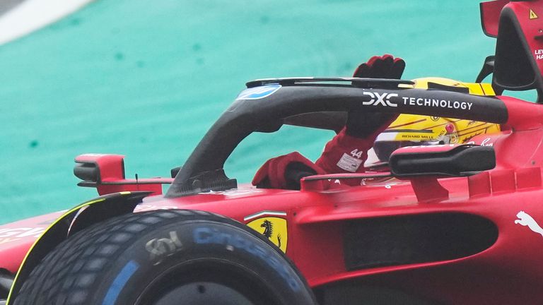 British driver Lewis Hamilton waves to fans as he steers a Ferrari Formula One SF-23 at the Ferrari private test track, in Fiorano Modenese, Italy, Wednesday, Jan. 22, 2025. (AP Photo/Luca Bruno)