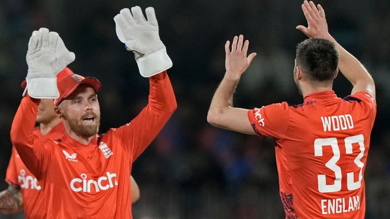 England's Mark Wood, right, celebrates with teammates after the dismissal of India's Abhishek Sharma, left, during the second T20 cricket match between India and England at M. A. Chidambaram Stadium in Chennai, India, Saturday, Jan. 25, 2025. (AP Photo/Mahesh Kumar A.)