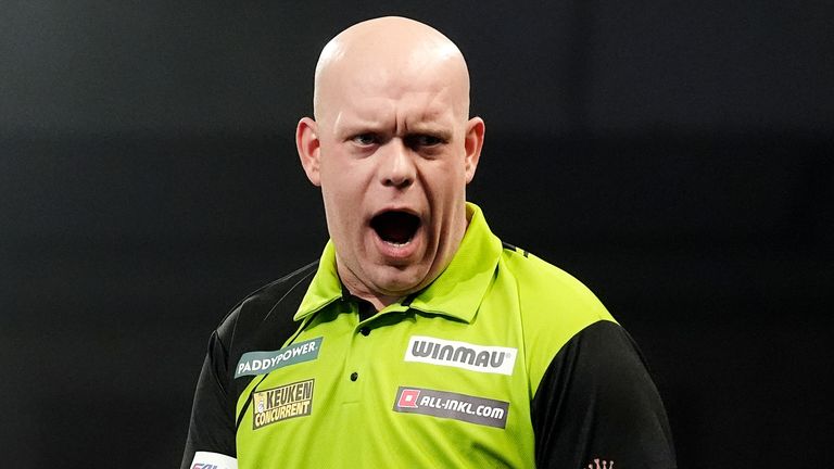 Michael van Gerwen celebrates during his semi-final match against Chris Dobey on day fifteen of the Paddy Power World Darts Championship at Alexandra Palace