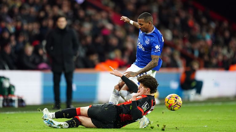 Milos Kerkez slides in on Ashley Young